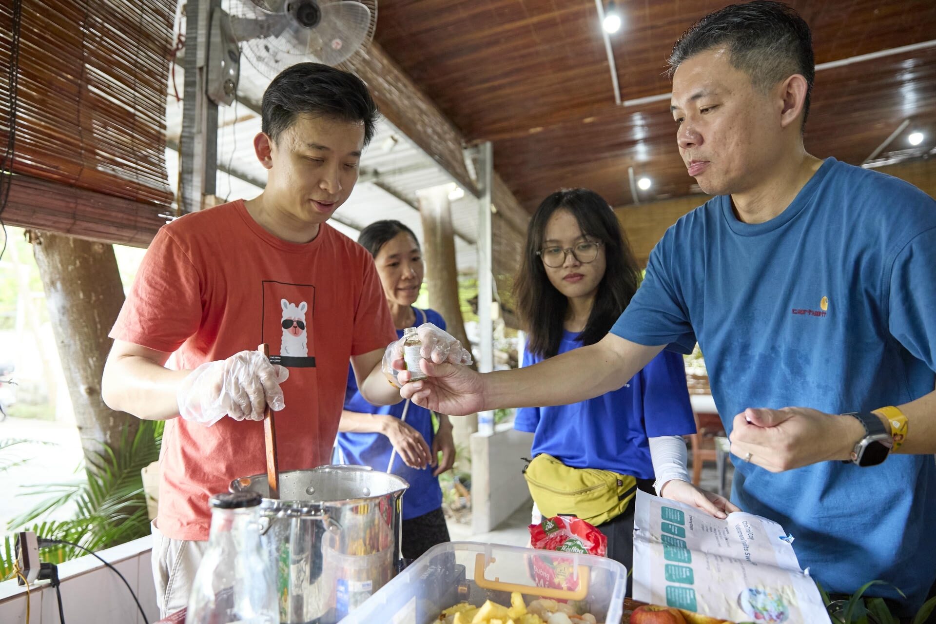 Students preparing food in a cooking workshop.