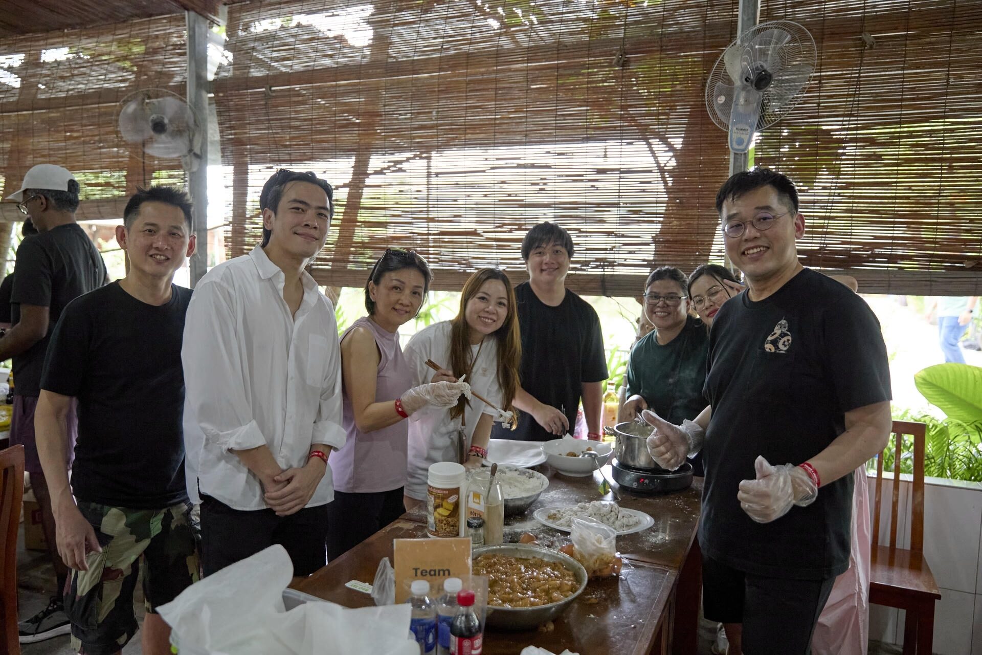 Teams working together to prepare meals with Jackfruit Adventure.