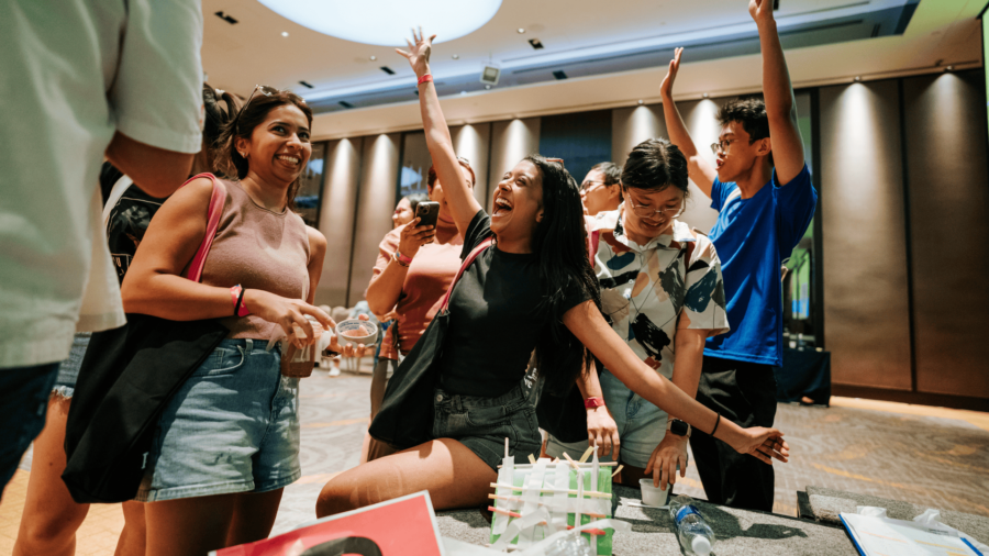 Corporate team participating in problem-solving activities to improve teamwork and collaboration in Vietnam