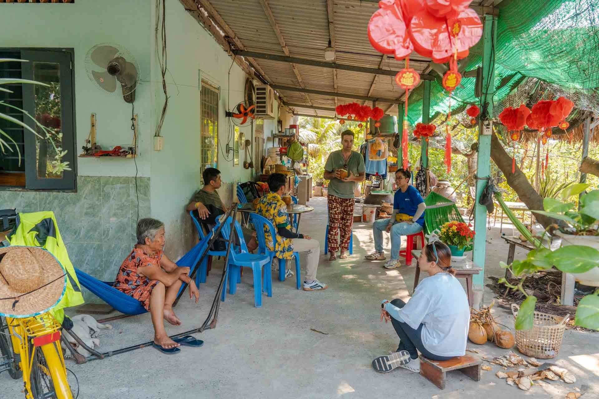 tourists visiting a local family's home during a village stop_eco tour_Jackfruit Adventure