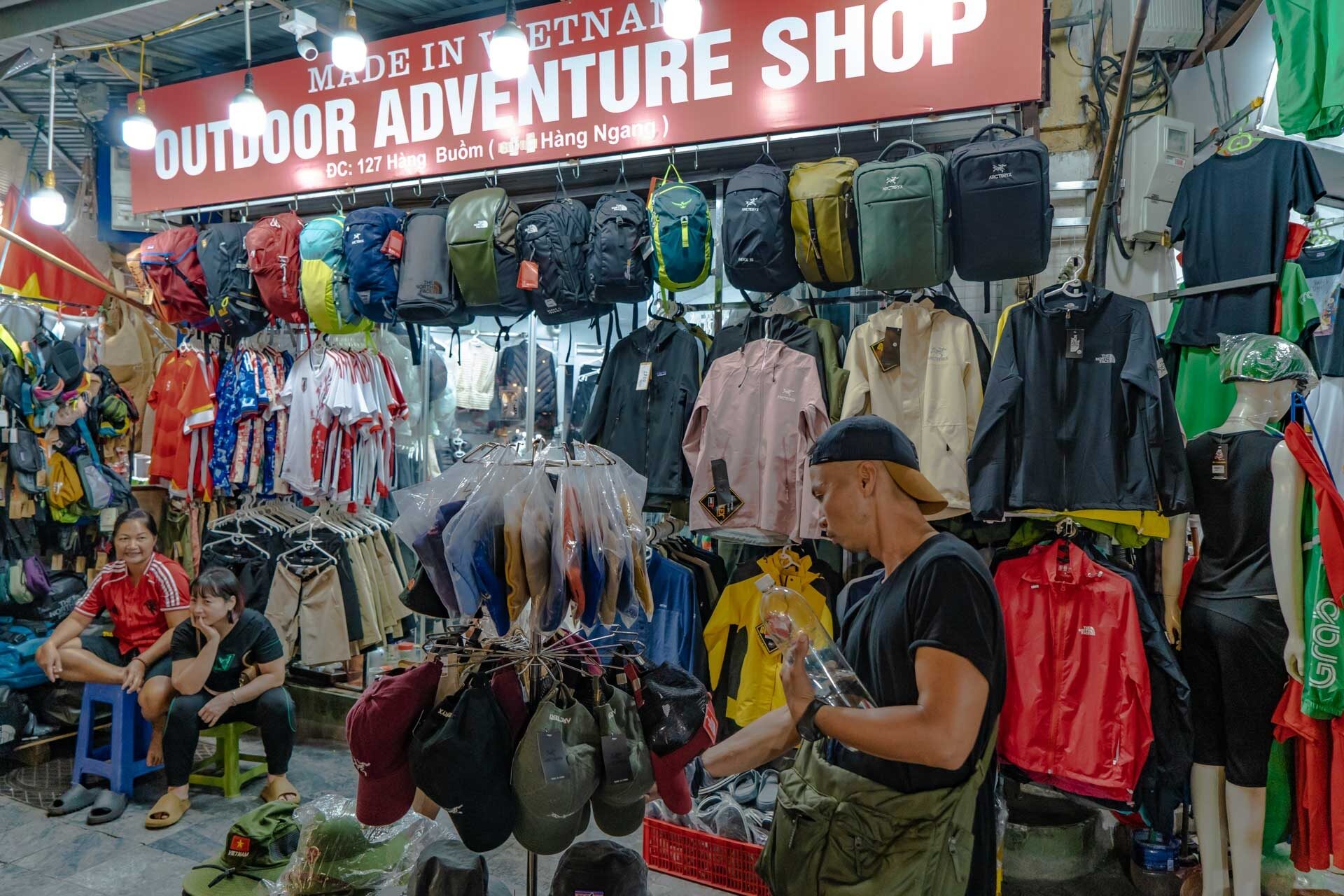 Outdoor clothing and backpacks for sale at the night market Hanoi, Old Quarter - Jackfruit Adventure