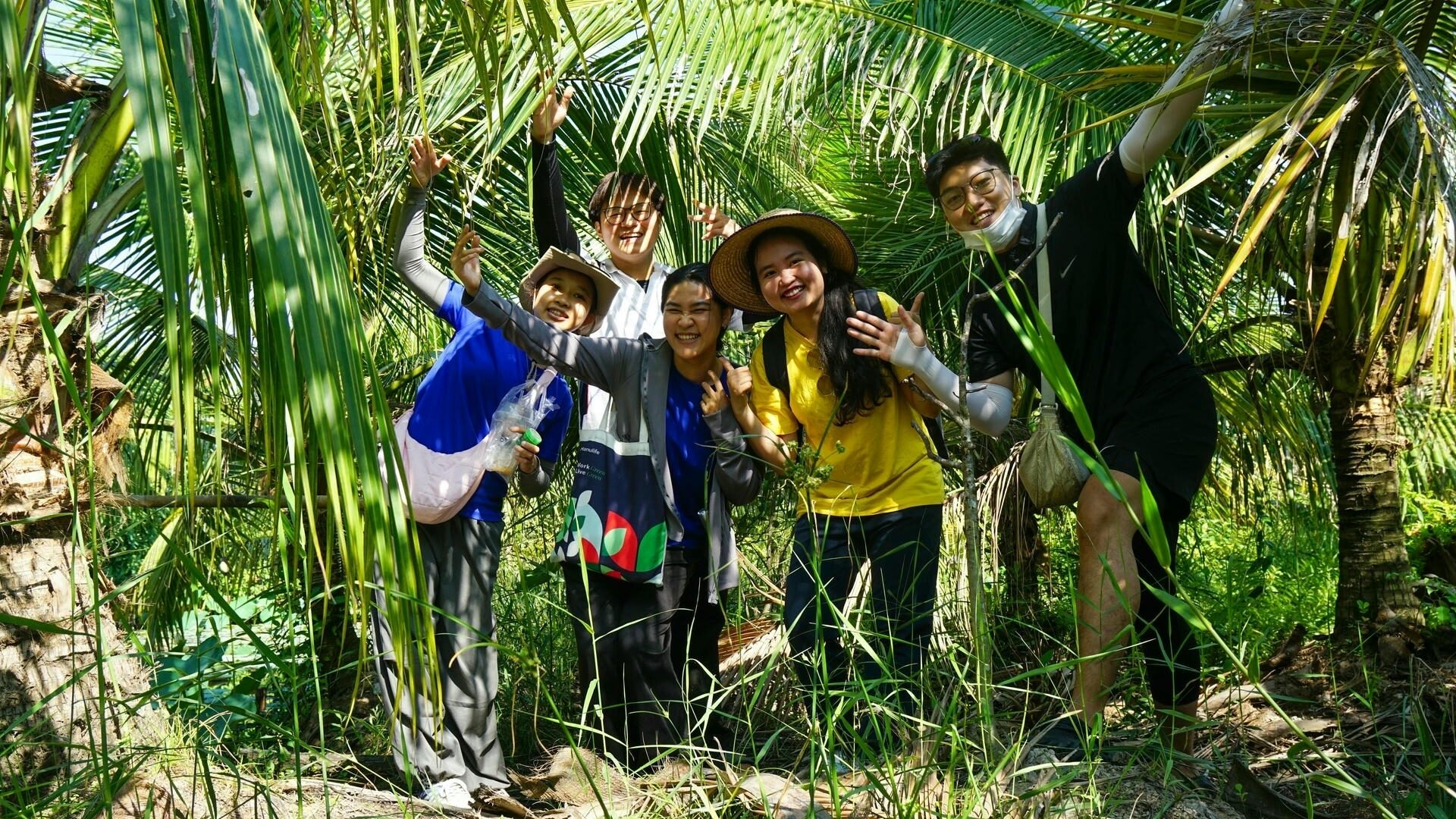 travelers pausing in a lush tropical garden_eco tour_Jackfruit Adventure